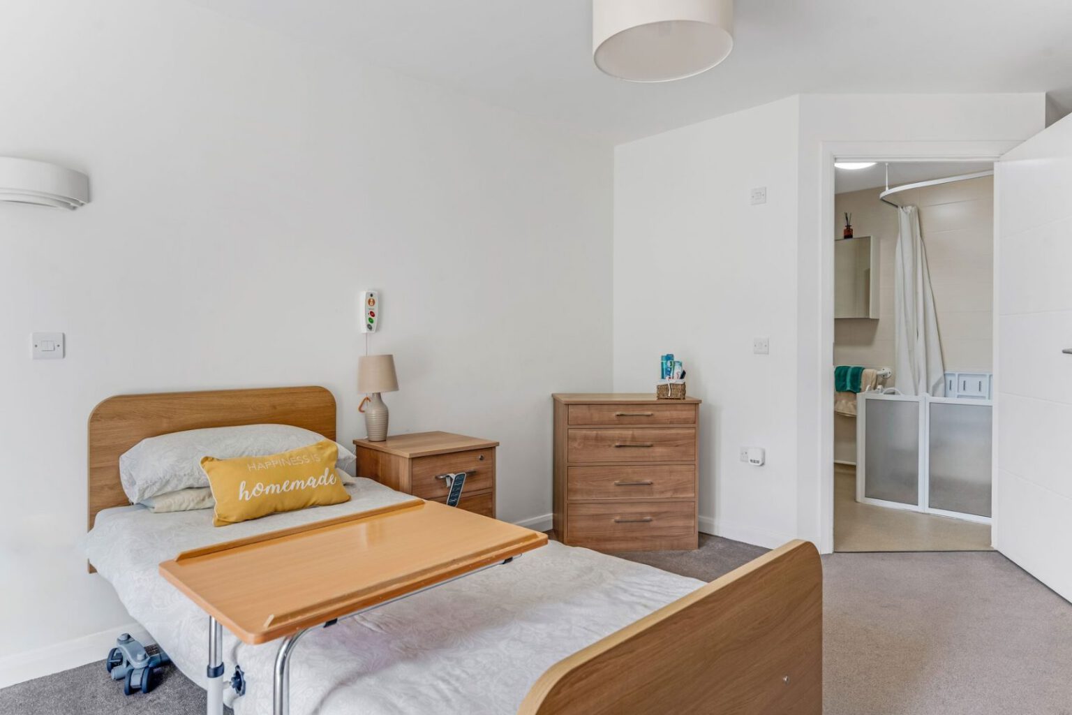 A bedroom at Downs House with an en-suite shower room