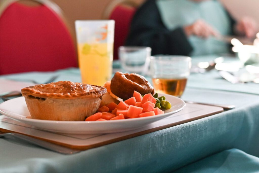 A freshly made pie lunch with vegetables in the Downs House dining room